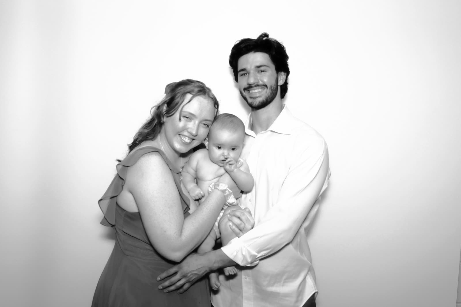 A couple holding their baby