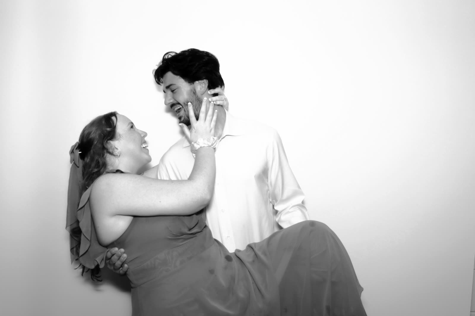 A couple laughing mid-frame