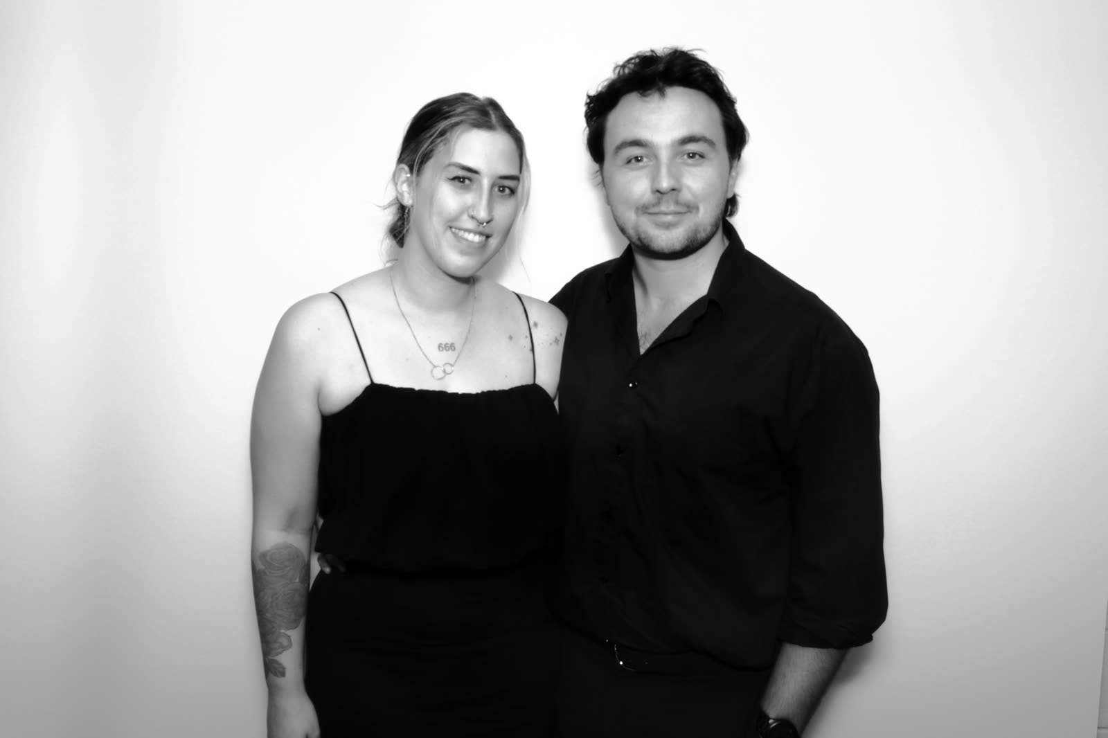A couple standing quietly for their portrait
