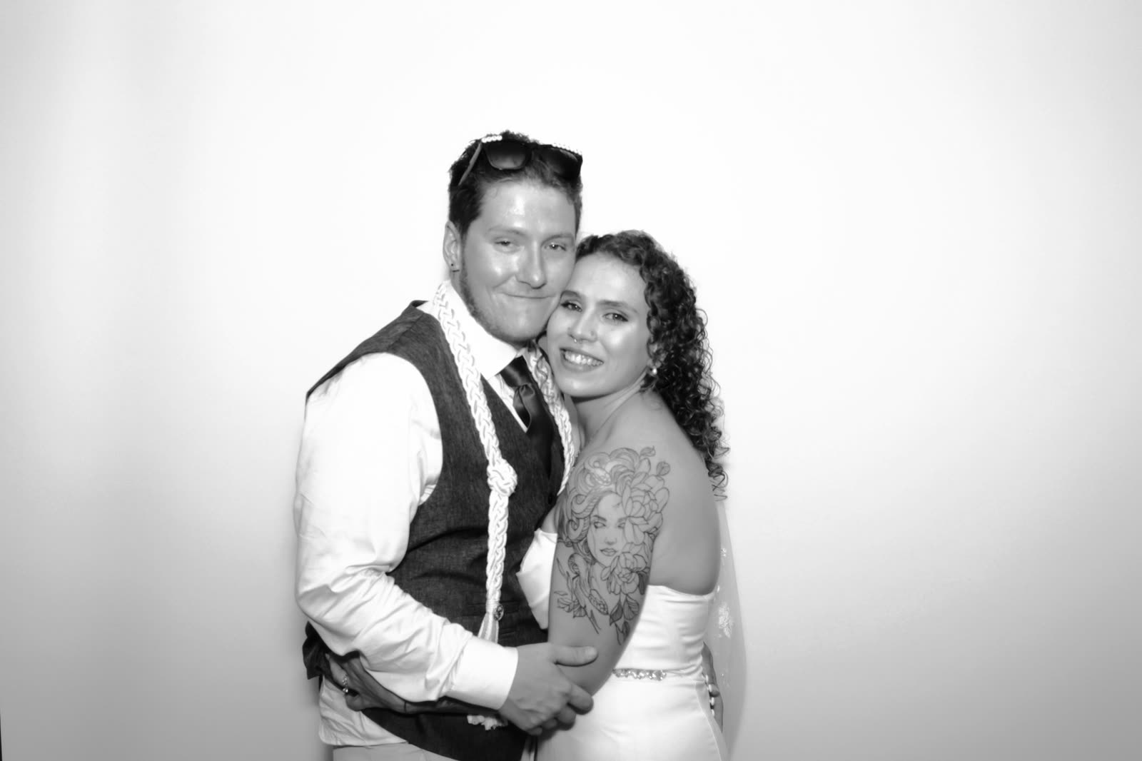 The couple, arm in arm in the booth