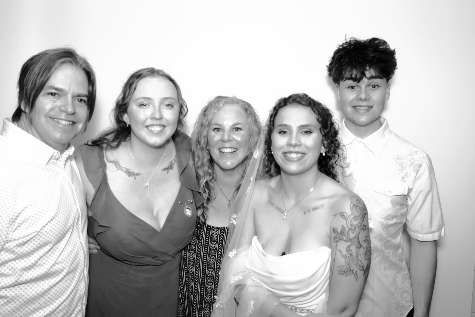 A family of five in the booth