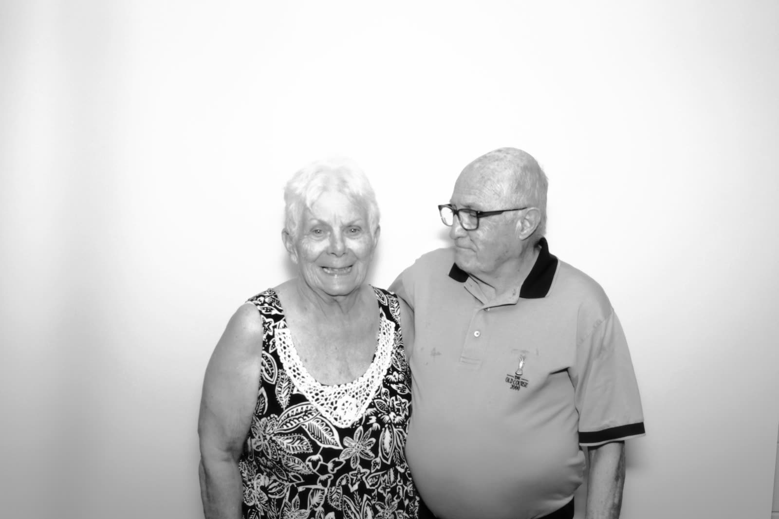 An older couple arm in arm