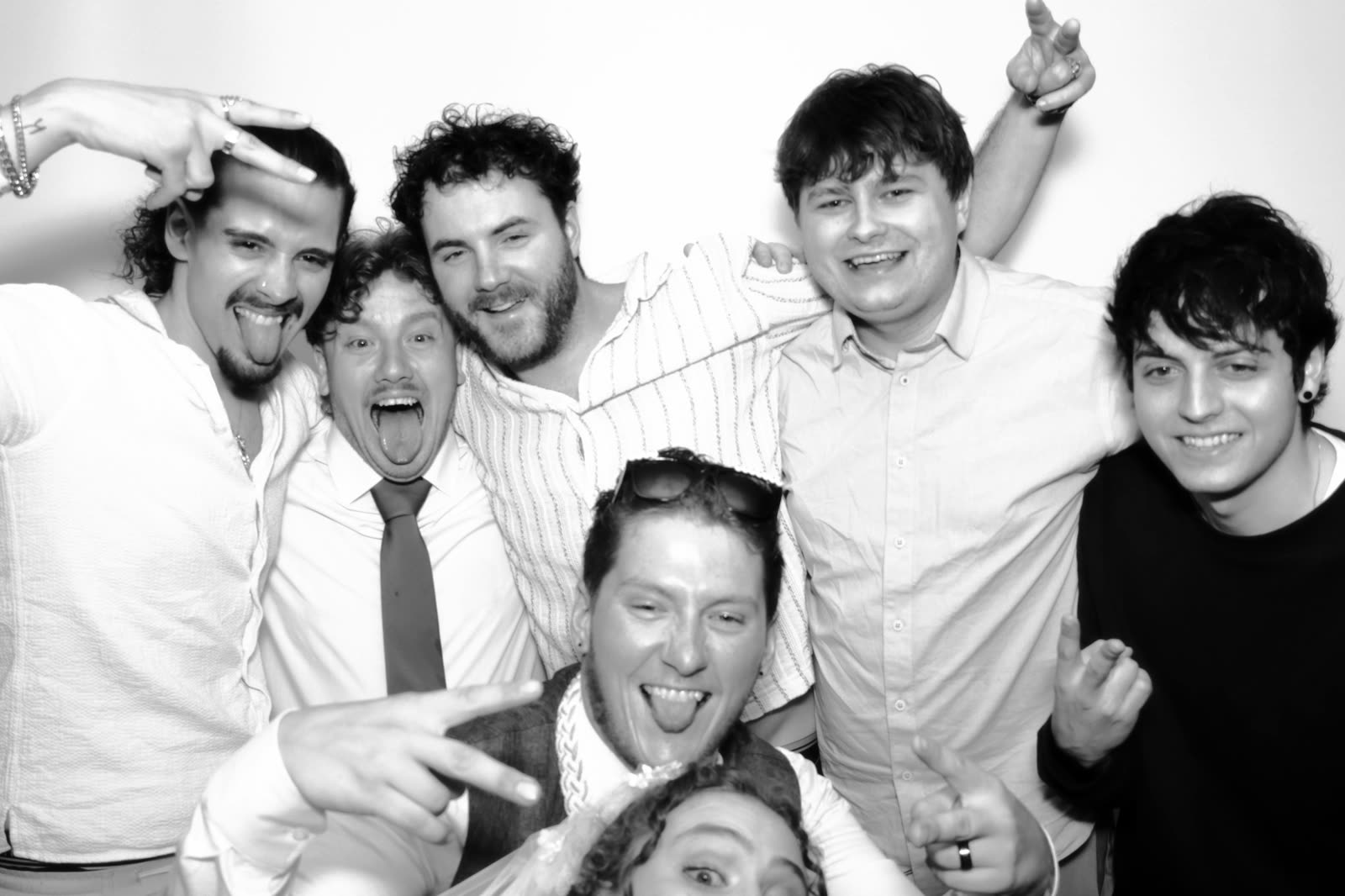 A group of friends piling into the booth